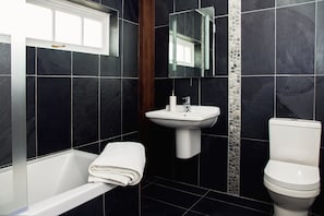 Luxuriously appointed stone bathrooms, with underfloor heating. 