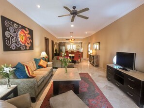 A view of the villa main living area - living room, dining room & kitchen