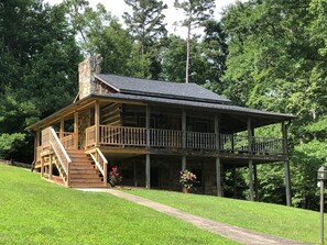 Logs from an old tobacco barn repurposed to make this gorgeous authentic cabin.