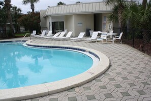 Tables and chairs for a game of cards by the pool!