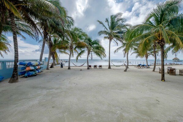 Your view sitting on your ground floor veranda.  Just steps onto the sandy beach