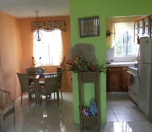 Convenient kitchen, dainty dining room.  What's for dinner?
