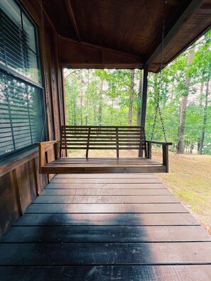 Come swing and chat on the front porch while you grill