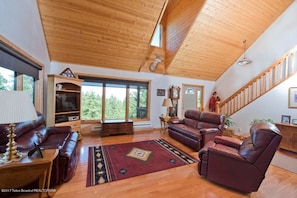 Living room with vaulted ceilings. 