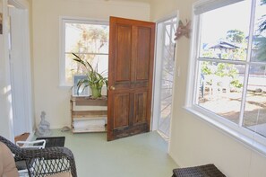 Front door opens into 'sunroom' perfect for early morning sun and coffee and dog