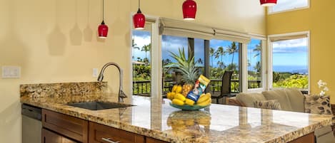 Kitchen looking out to golf course and ocean 