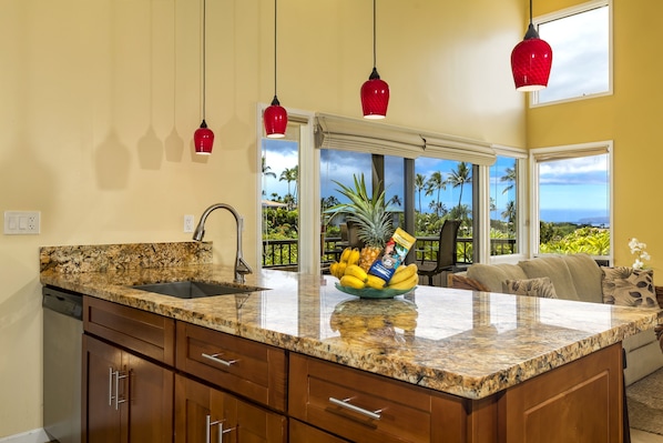 Kitchen looking out to golf course and ocean 