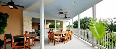 Back patio overlooking the Guadalupe River. Perfect place to relax with friends