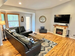 Large family room sectional, 65" Smart TV & electric fireplace to keep you cozy