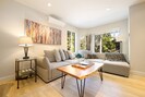 Bright, open and airy define the main living level of this luxurious townhome