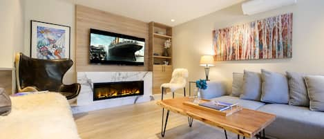 Great entertaining space w/ 77” OLED Smart TV, Sonos Surround Sound & fireplace