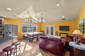 The vaulted ceiling in the family room lets in lots of light from the lake side.