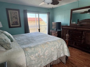 Let the ocean waves lull you to sleep in a king bedroom that opens onto lanai.