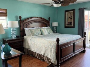 Let the ocean waves lull you to sleep in a king bedroom that opens onto lanai.