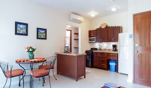 Living room - Open concept living room/ kitchen area with air condicioner.