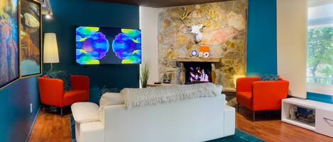 Restful Living Room: 70" StreamingTV (NetFlix, Amazon, etc.) e-Fireplace.