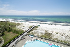 Top-floor Condo Overlooking White Sand Beach and Water-front Swimming Pool