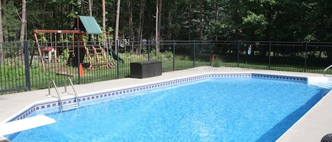 In-ground pool, tons of pool toys, backyard playground, and horseshoe pit