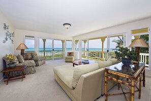 Living room with ocean and beach views 