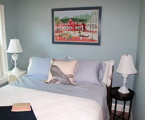 Bedroom with queen-sized bed.