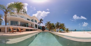 Infinity pool with direct access to the beach and overlooks the Caribbean Ocean