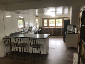 Large, modern kitchen with lots of counter & storage space and a terrific view.