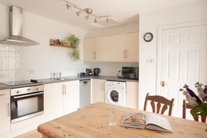 Generously sized and well-equipped kitchen including a full size fridge freezer