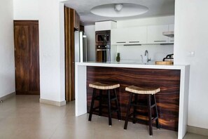 NEW DESIGNER KITCHEN WITH MODERN APPLIANCES, ALSO INCLUDES WASHER/DRYER