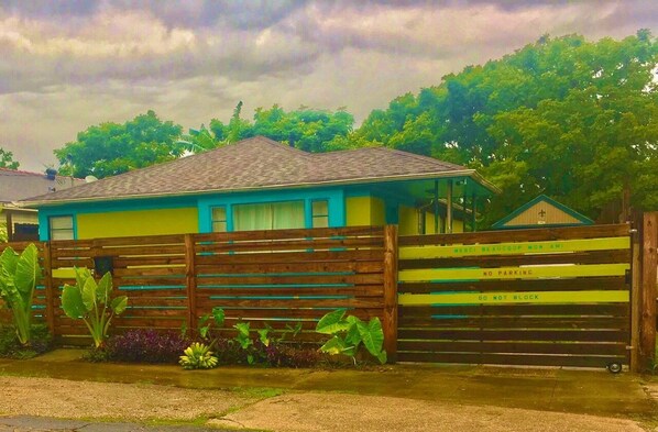 This 1-story midcentury house has Caribbean style within a fully-gated compound.