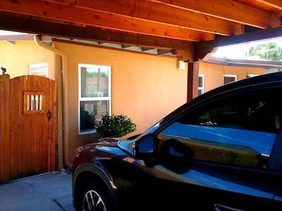 Secure carport, amazing Views and Reviews!  Private suite with patio. 