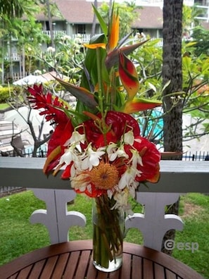 Our lanai dining table with tropical flowers from Farmer's Market a block away