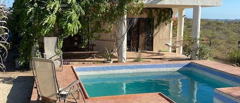 Back yard view with 2 bedroom casita patio in the background 