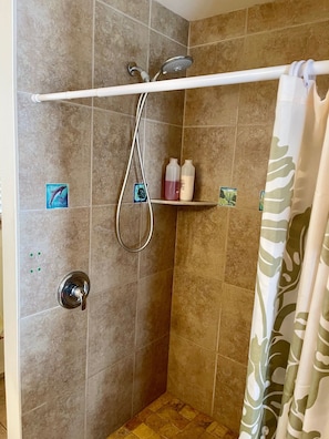 second bathroom - shower, sink and toilet