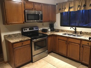 Kitchen comes equipped with everything you need for cooking.