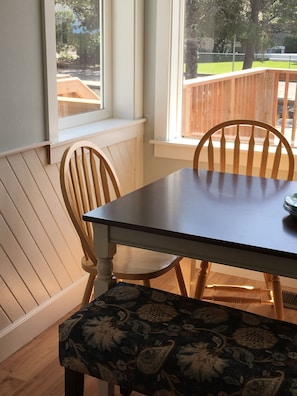 Dining table for six. Additional seating for three at counter.