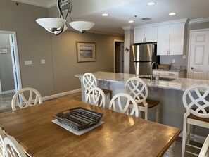 Dining table for 6 and 3 seats at the kitchen counter 