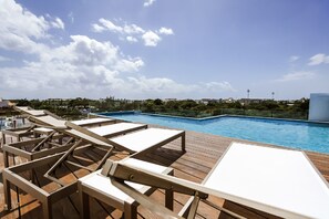 roof top pool with a beautiful view and partial view of the ocean...