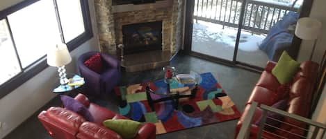 Overhead view of Family Room. Corner, 3rd floor unit has lots of windows.