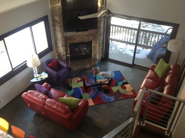 Overhead view of Family Room. Corner, 3rd floor unit has lots of windows.