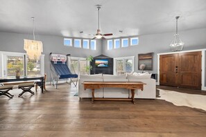 Huge living room with 16' vaulted ceiling, fireplace, and other fun activities