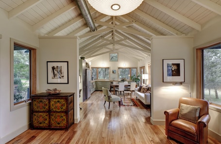 View of living room and kitchen from bedroom.