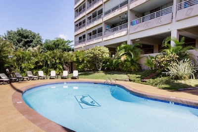 Stroll to Beach from Ocean View Condo with Pool & Rooftop Deck