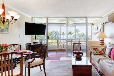 Views of the ocean and swaying palms are visible even from inside the condo