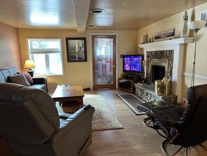 Living room showing wood burning fireplace
