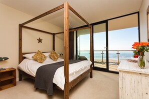 Master bedroom has kingsize four poster bed