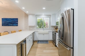 Spacious kitchen with plenty of counter space for preparation and eating