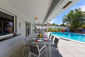 The outdoor dining room table comfortably seats 8 people