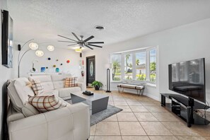 The livingroom has a large flat screen TV with Roku, YouTube TV, and Netflix