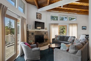 Living Room w/ Gas Fireplace & Slider to Deck