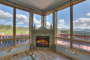 Floor to ceiling windows that immerse you in relaxing mountain views or star gaze from the comfort of your couch